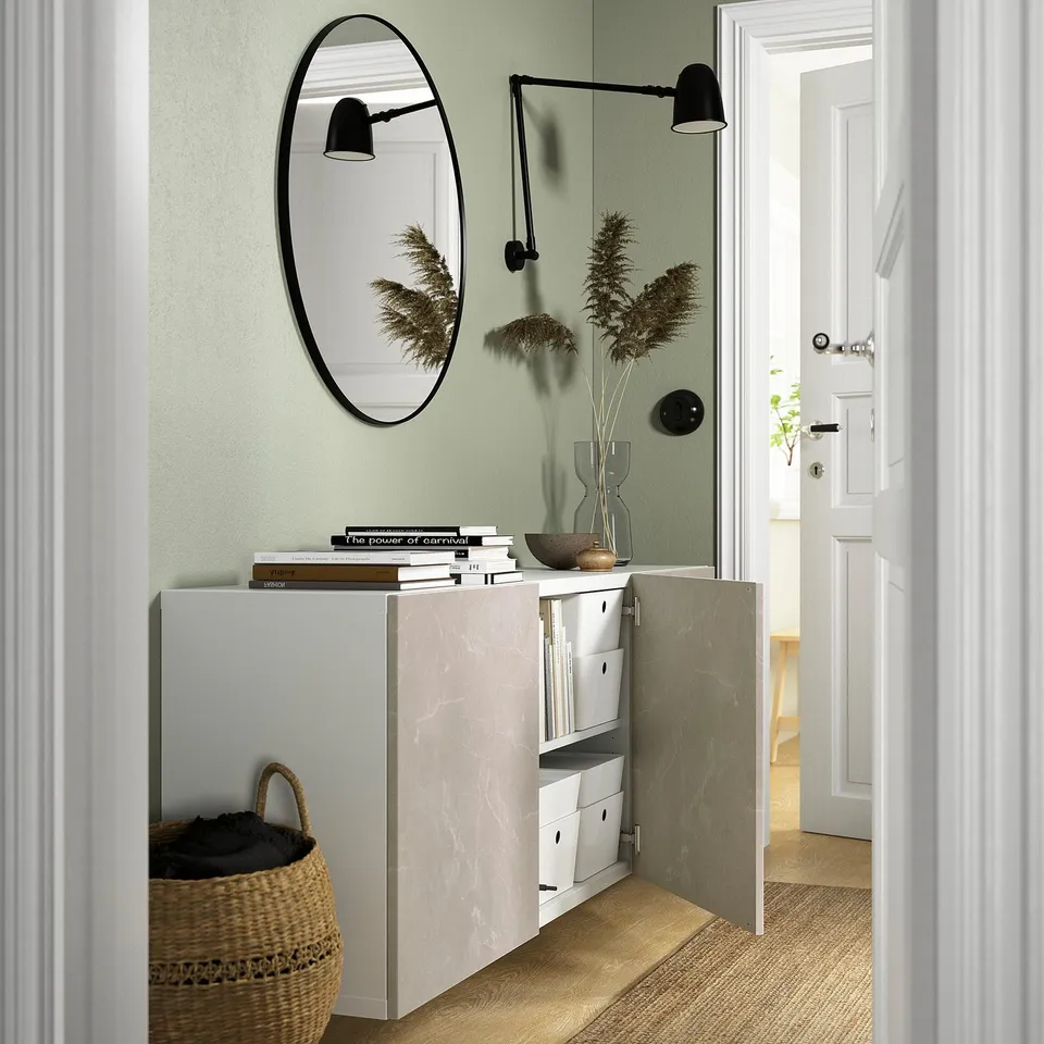 Modern entryway with BESTÅ cabinet, mirror, and basket.