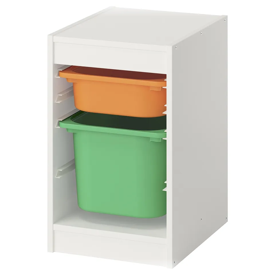 A white wooden TROFAST storage unit with two colourful plastic bins: orange and green.