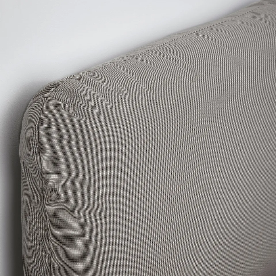 Modern bed with inclined headboard, two soft pillows. Quality upholstery, sleek design.