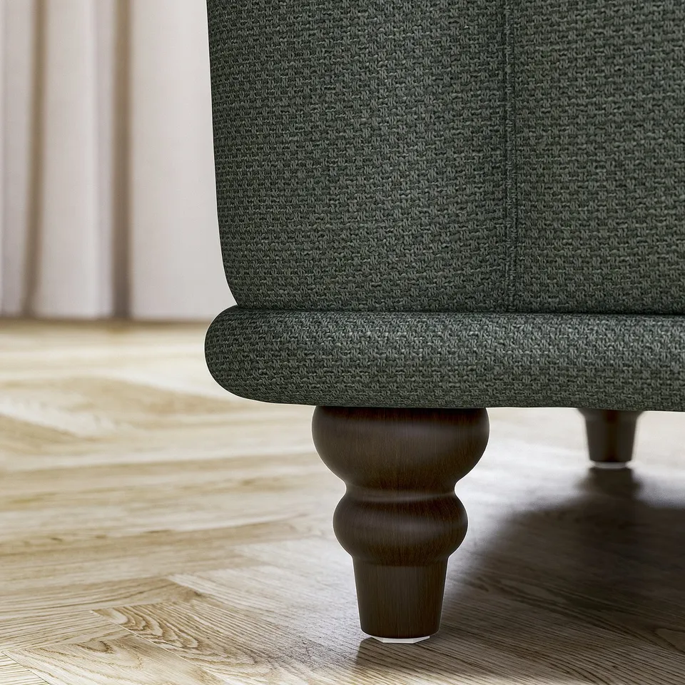 Green VISKAFORS sofas, curvy leg on wood floor.