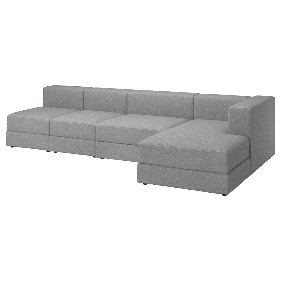 A grey JÄTTEBO modular sofa with a chaise longue, featuring a soft, modern design with clean lines and comfortable cushions.