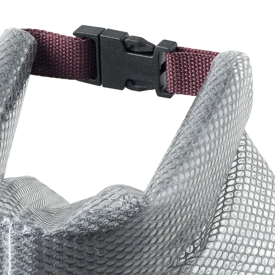 Close-up of waterproof bag with textured surface and sturdy clip. Silicon-like feel, snap strap handle.