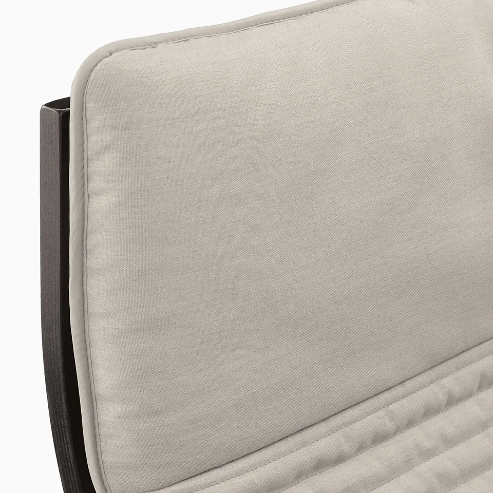 Modern upholstered chair with sleek lines; grey fabric, high back support.