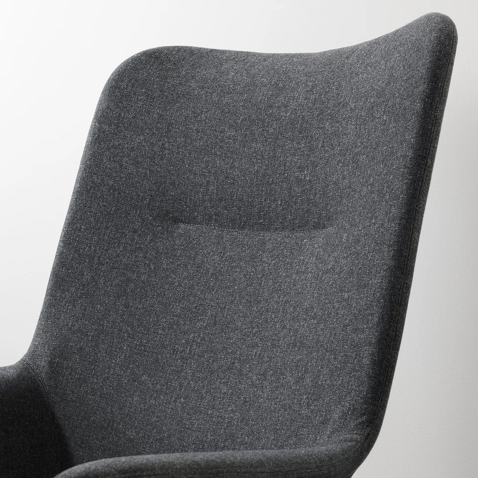 Close-up of VEDBO armchairs plush, dark grey back, showcasing its sleek, supportive design.