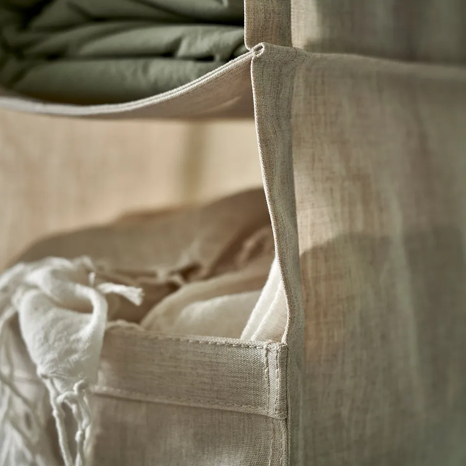 Hanging fabric storage with multiple compartments for organising clothes, part of the PURRPINGLA series.