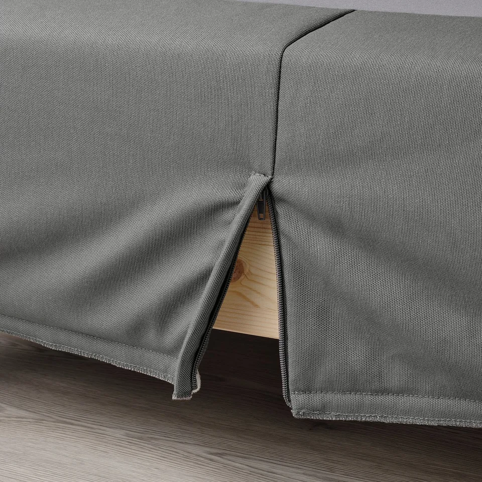 Close-up of LYNGÖR bed base showing easy-to-clean, reinforced fabric and flat slats for support.
