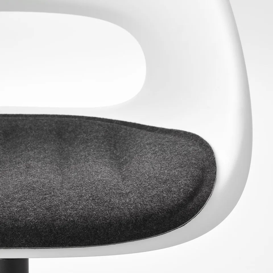 Modern office chair close-up. Dark grey seat cushion on sleek, white frame. Padded for comfort.
