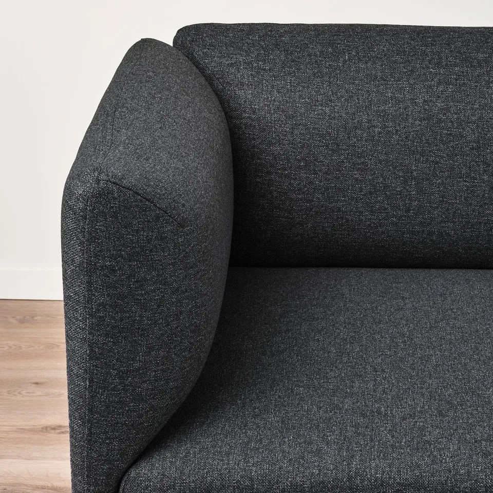 Dark grey fabric sofa, well-cushioned and supportive, elegant melange effect, clean and modern design.