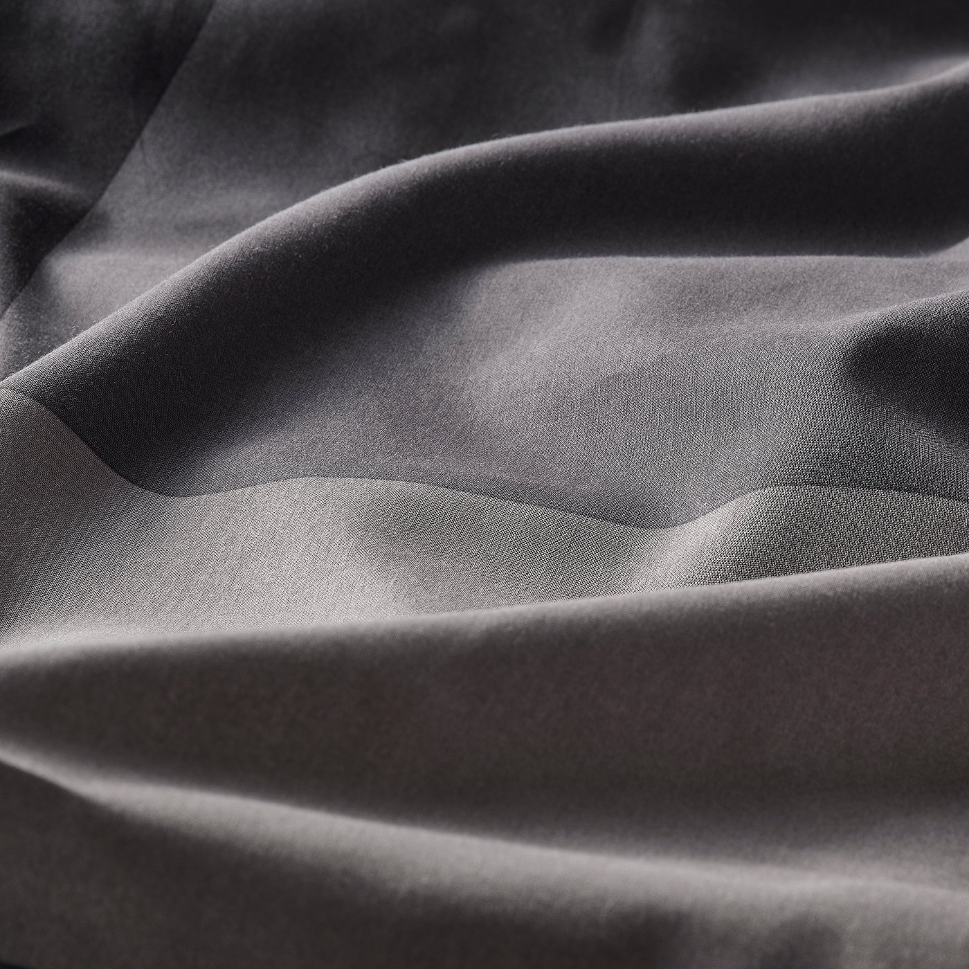 Soft, textured fabric close-up, showcasing high-quality weave and smooth feel.