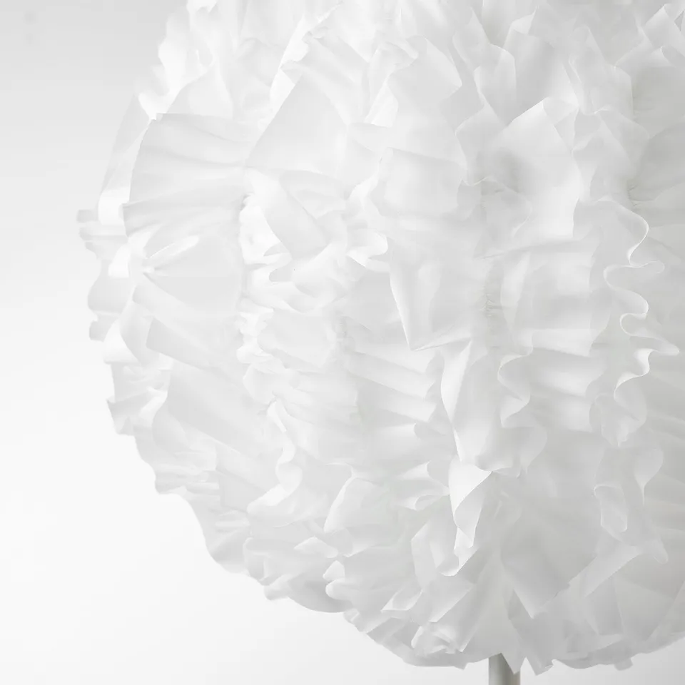 Elegant white lampshade with soft, flowing fabric, creating a cosy ambiance.