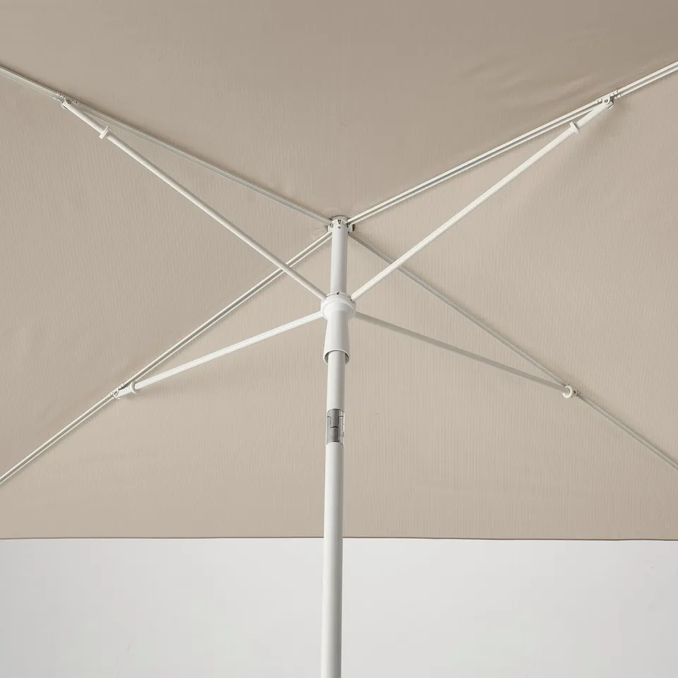 A premium parasol with sturdy, adjustable metal frame and durable fabric, highlighting its quality construction.