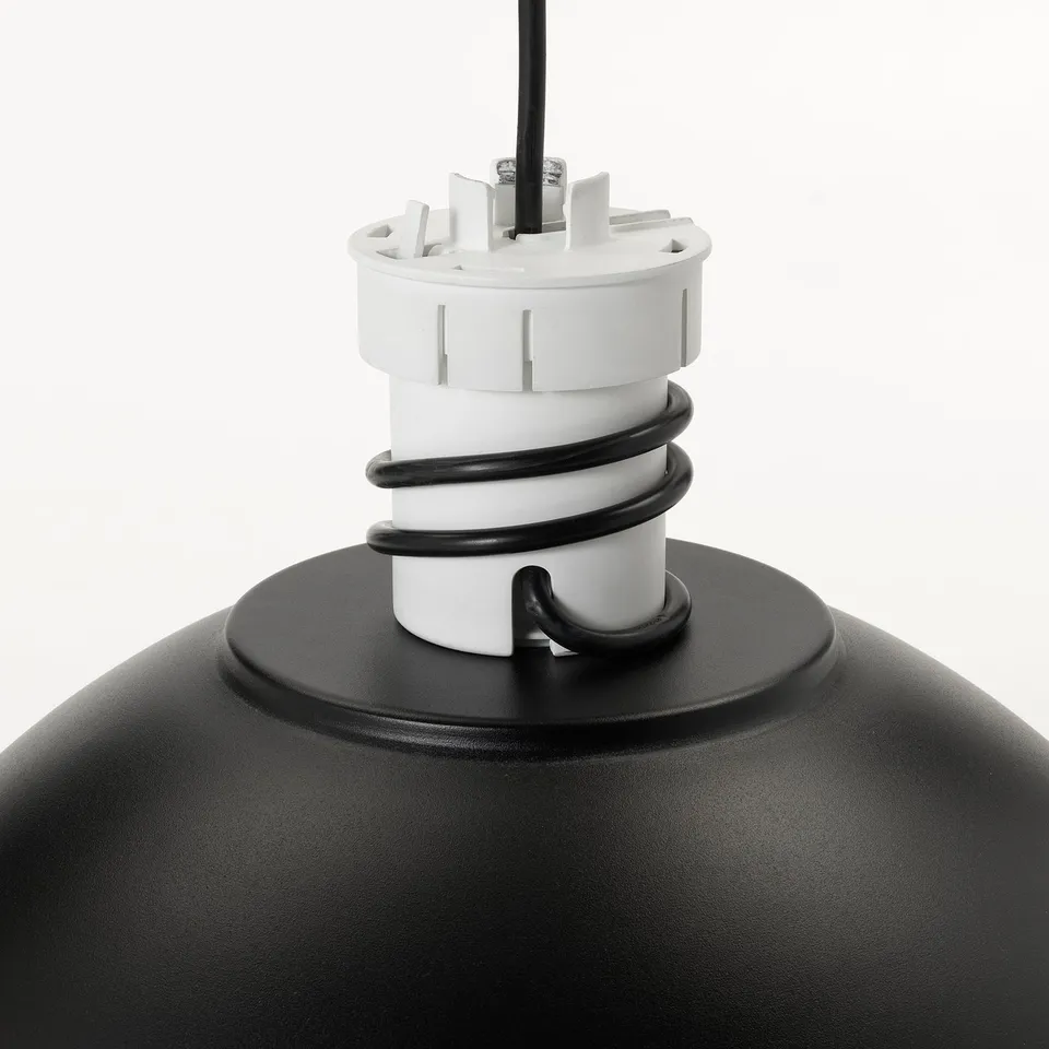 Black pendant lamp with adjustable cord and white top, ceiling hook visible.