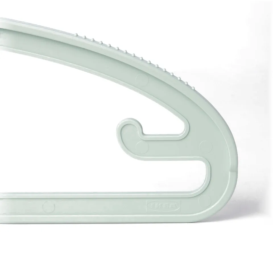 Light green plastic hanger with anti-slip notches and hooks, reflecting durable, versatile design.