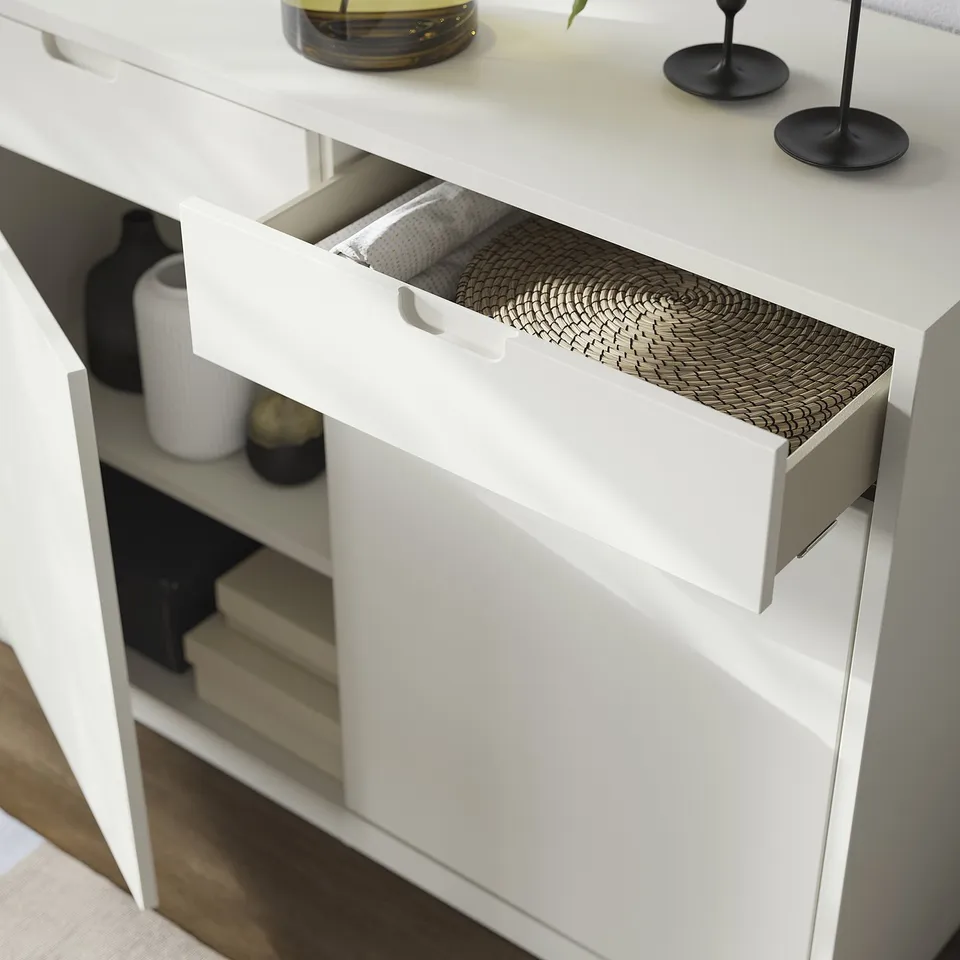 White TONSTAD furniture drawer partly open showcasing a woven tray. Modern, off-white, and stylish design.