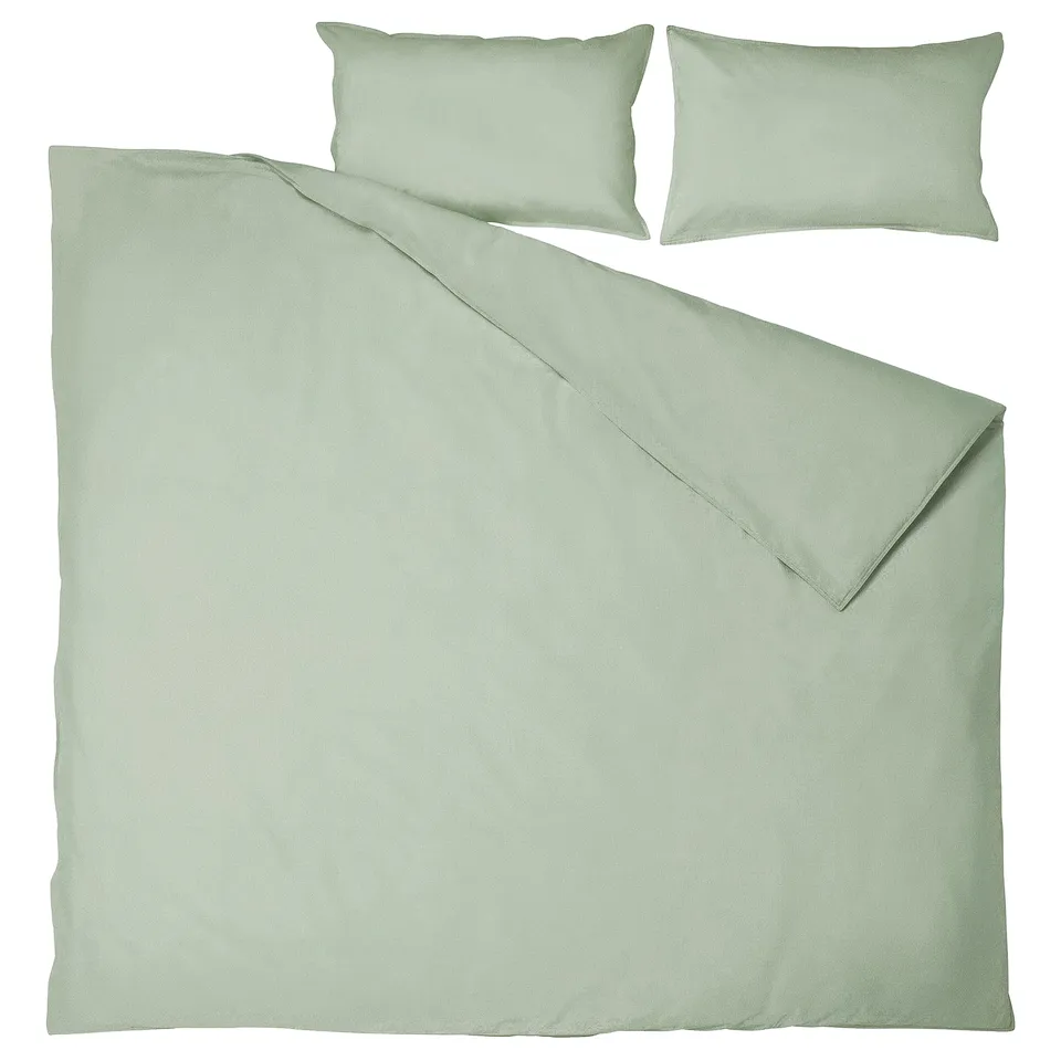 Sage green bedding set: one duvet, two pillows. Soft, recycled cotton, simple design.