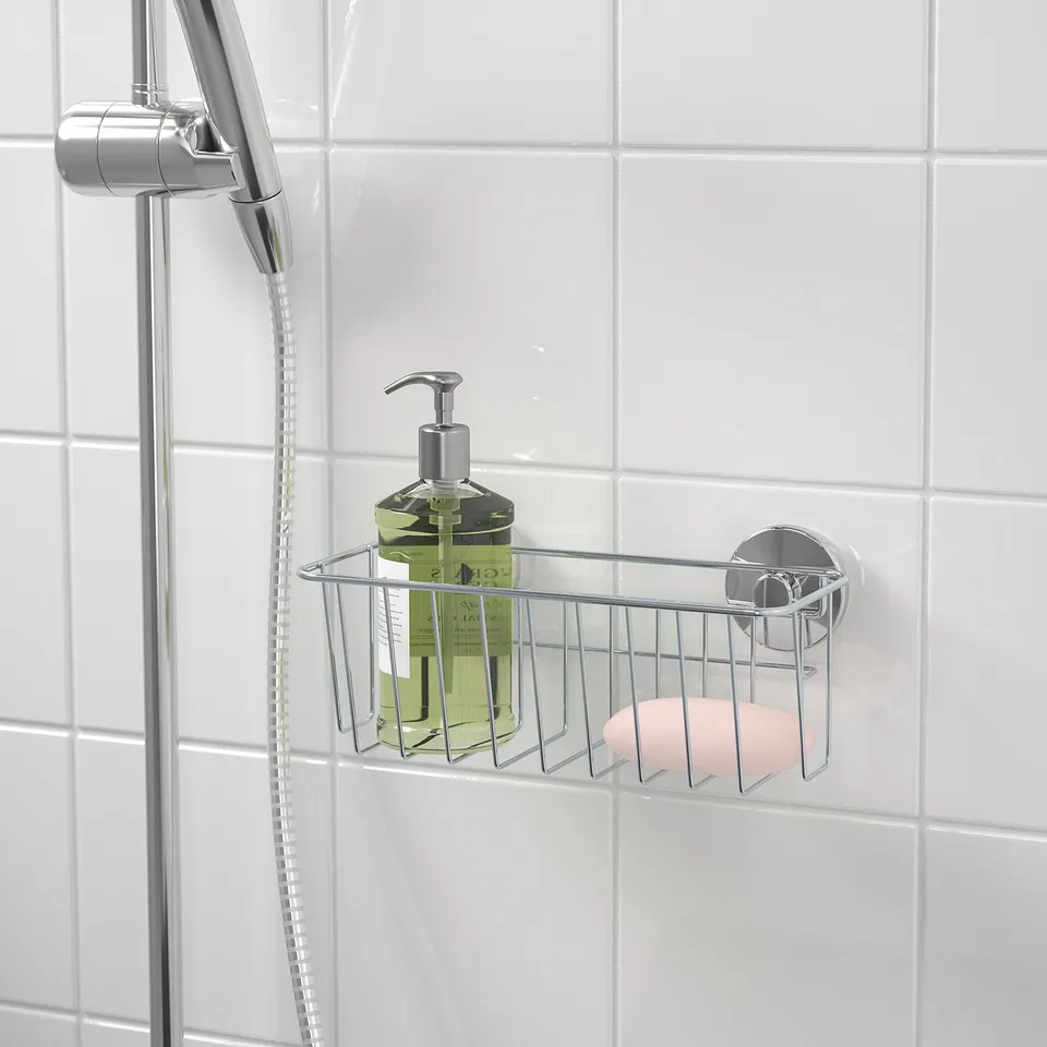 Shower basket with suction cups holds soap and shampoo, grips tiles, no drilling needed.