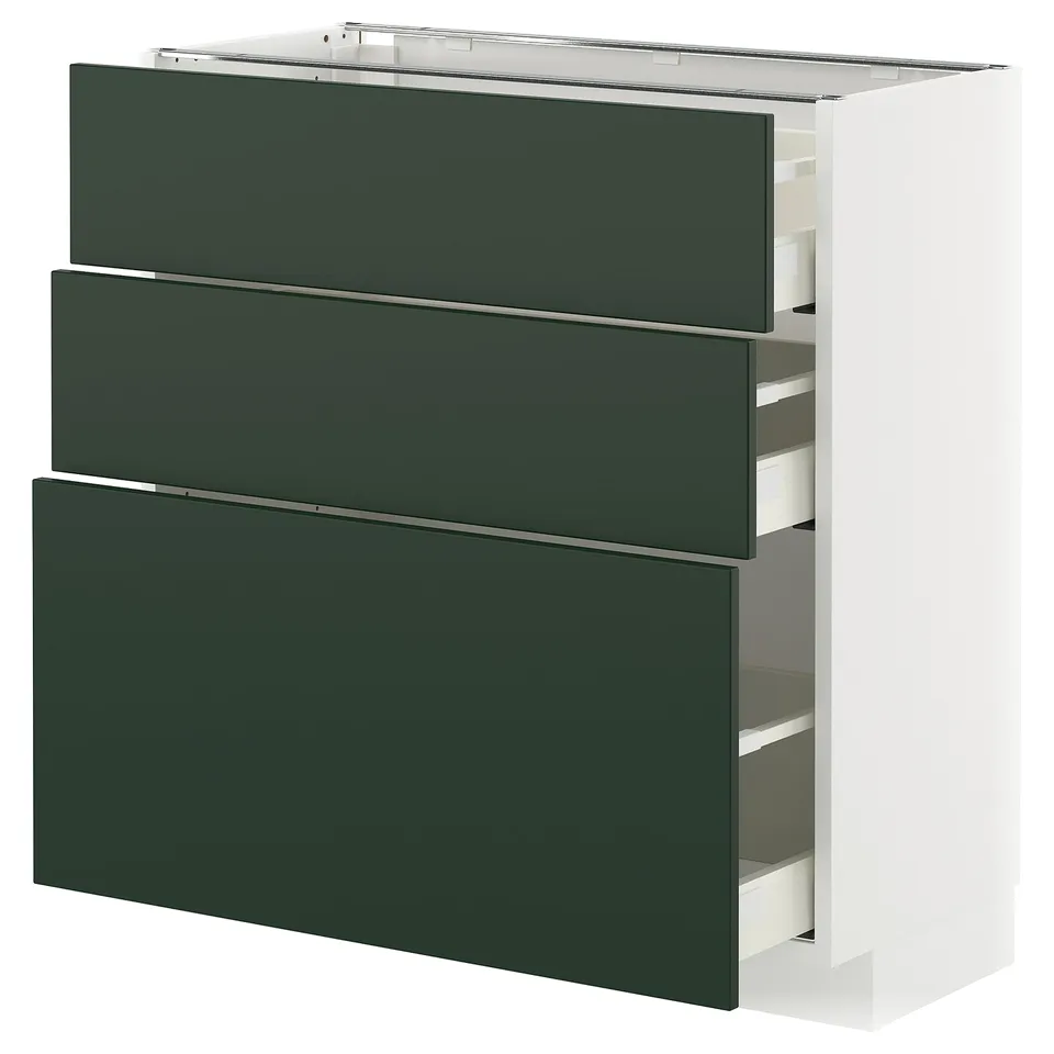 A modern kitchen unit. It three dark green drawers and a white frame. The drawers are sleek and extend fully for easy access.