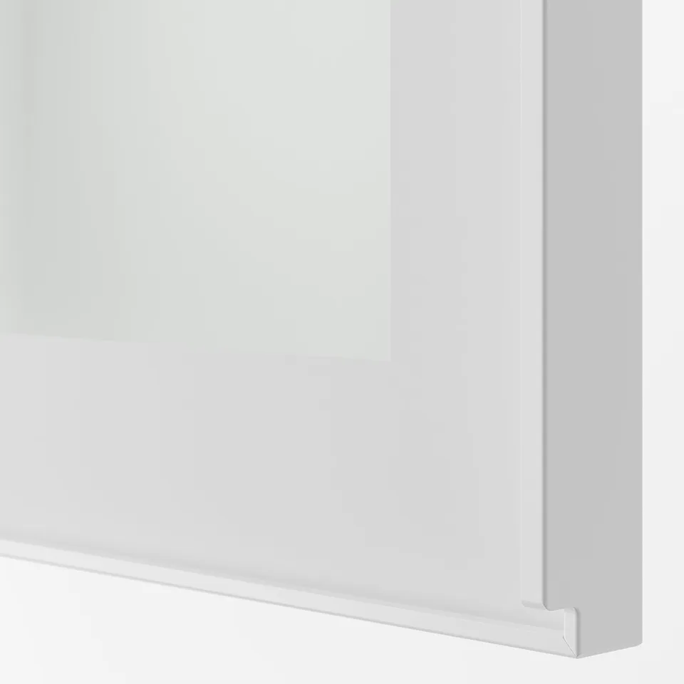 Close-up view of white glass door with metal frame, showcasing clean lines and sturdy construction.