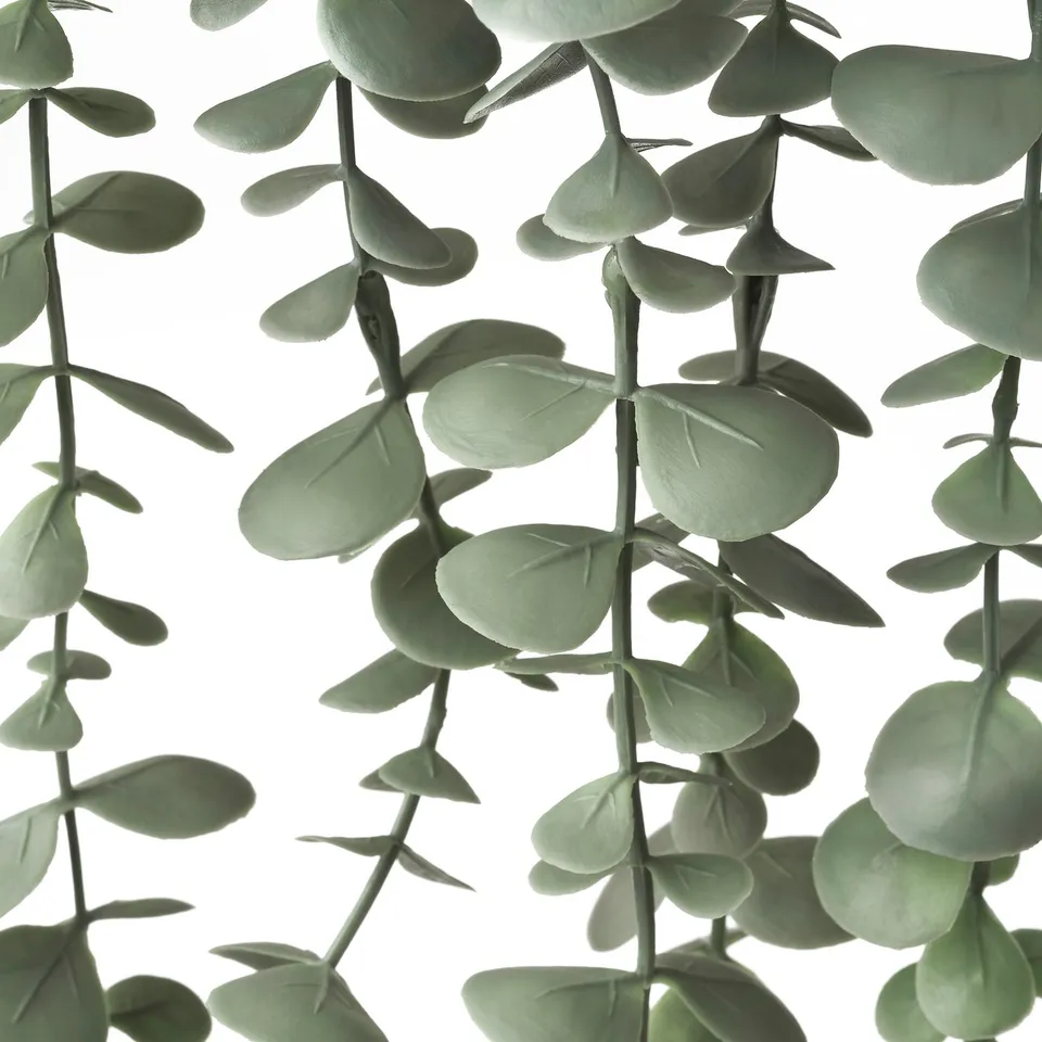 Artificial eucalyptus plant with vibrant, lifelike leaves.