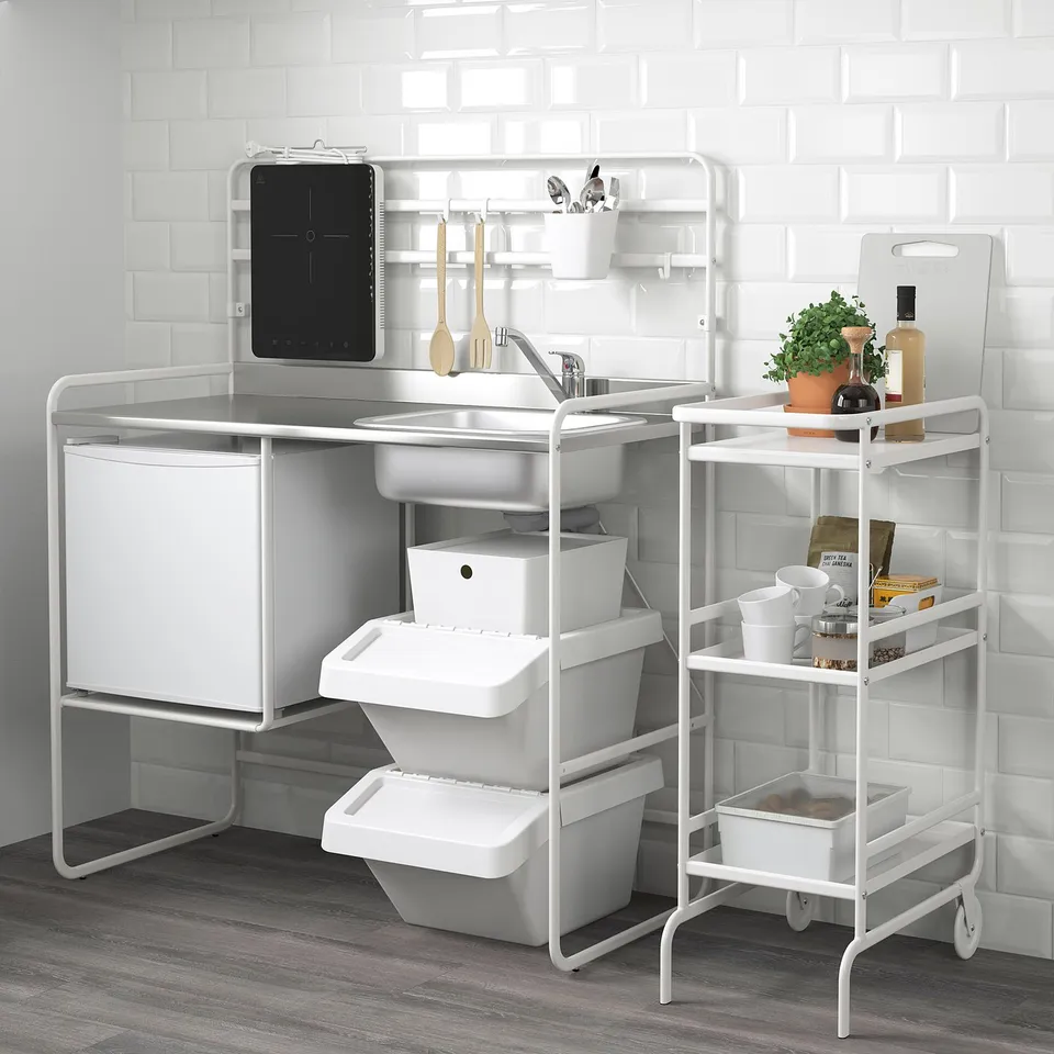 Modern compact kitchen setup: sink, storage, shelves. Ideal for small spaces, includes accessories.