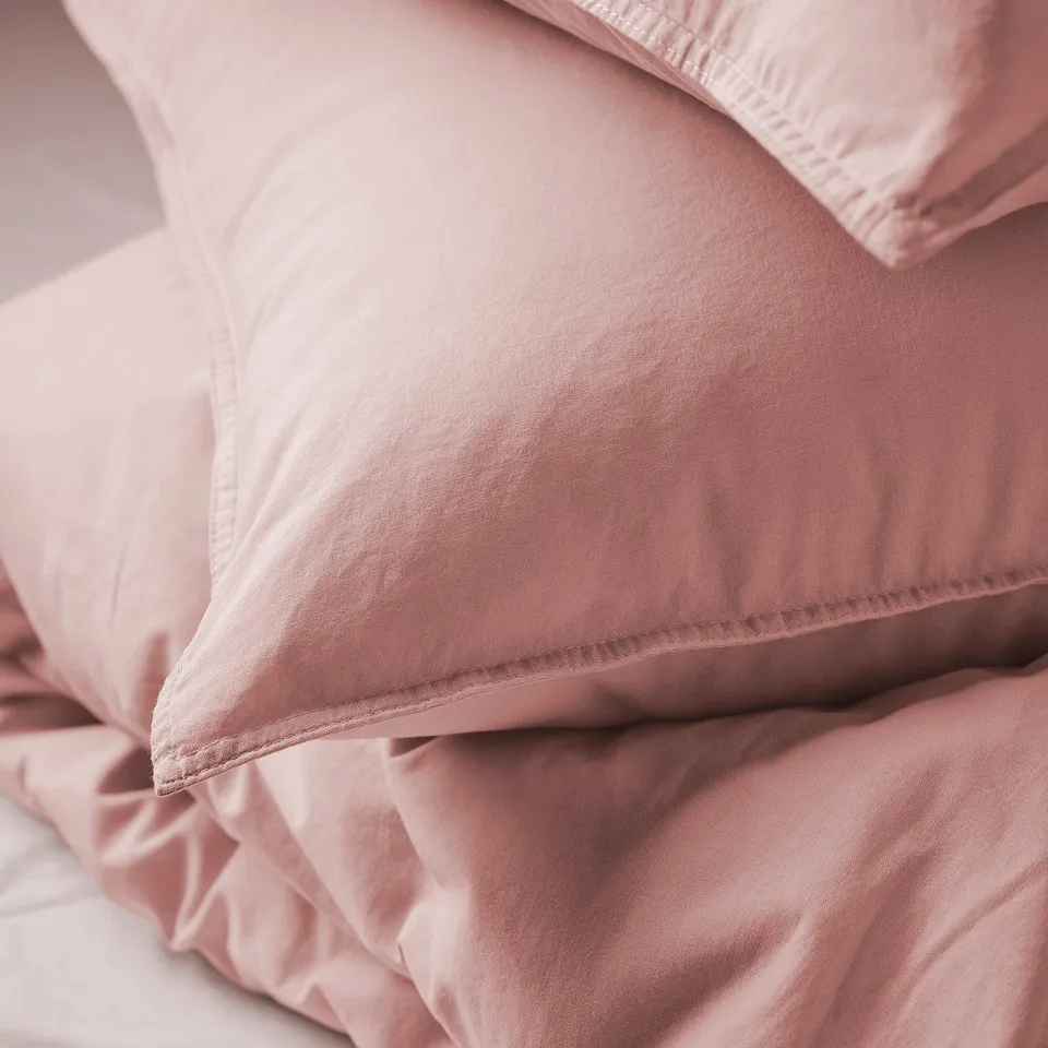 Soft, pink bedding with smooth, high-quality fabric.