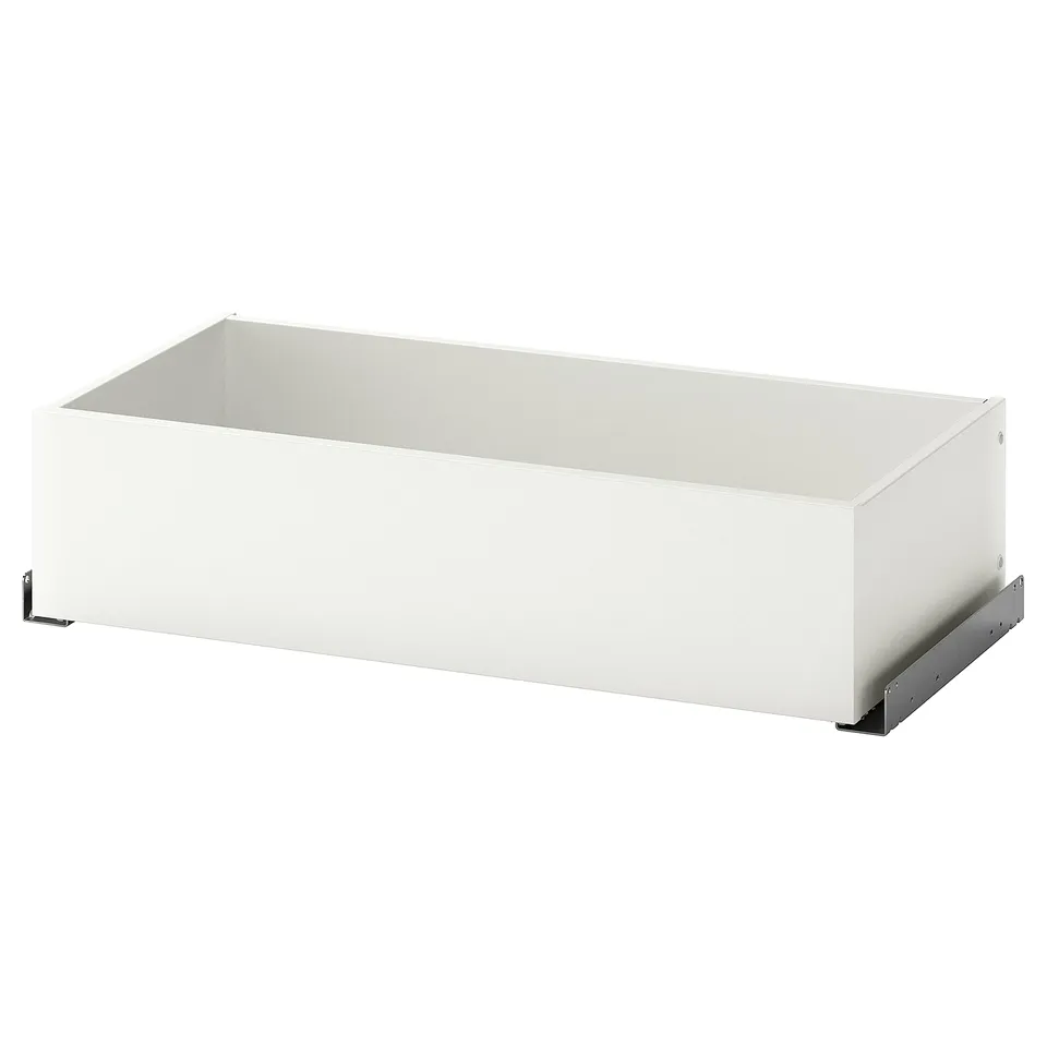 A KOMPLEMENT white drawer for wardrobe storage, made of paper foil and fibreboard with a sleek, rectangular design.