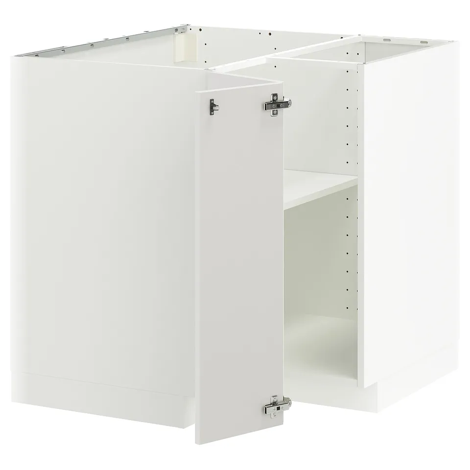 White METOD kitchen cabinet set with glossy finish and metal hinges.