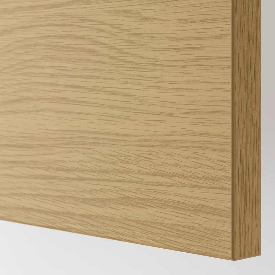 Close-up of sleek, natural wood-textured kitchen cabinet panel with smooth finish.