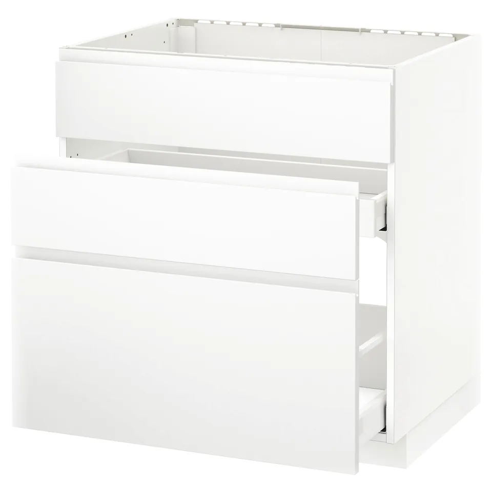 A white METOD kitchen unit with drawers and a cabinet, featuring a sleek, modern design.