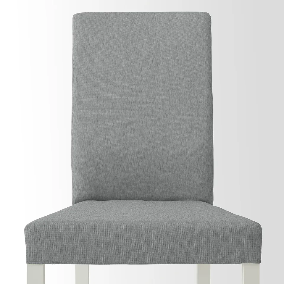High-quality, modern chair. Upholstered in grey fabric, featuring sturdy wooden legs.