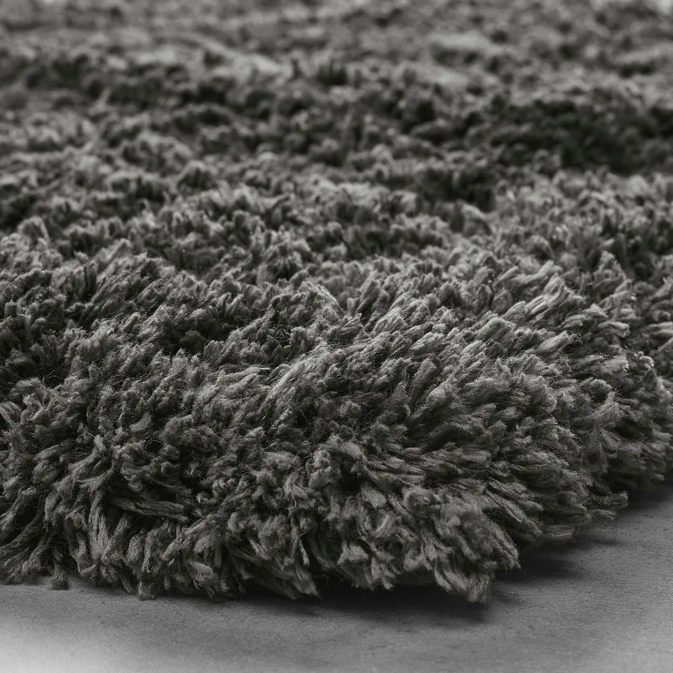 Fluffy bath mat close-up, soft texture visible, high pile details, eco-friendly material.