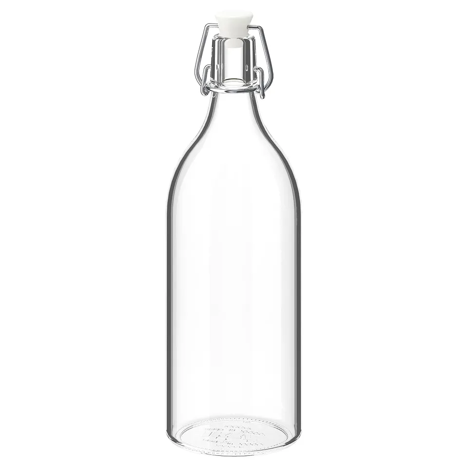 KORKEN glass bottle, clear, with metal clamp and white stopper, cylindrical shape.