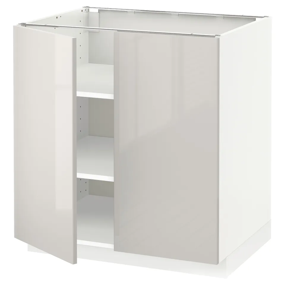 A white high-gloss METOD kitchen cabinet with an open door, revealing adjustable shelves inside.