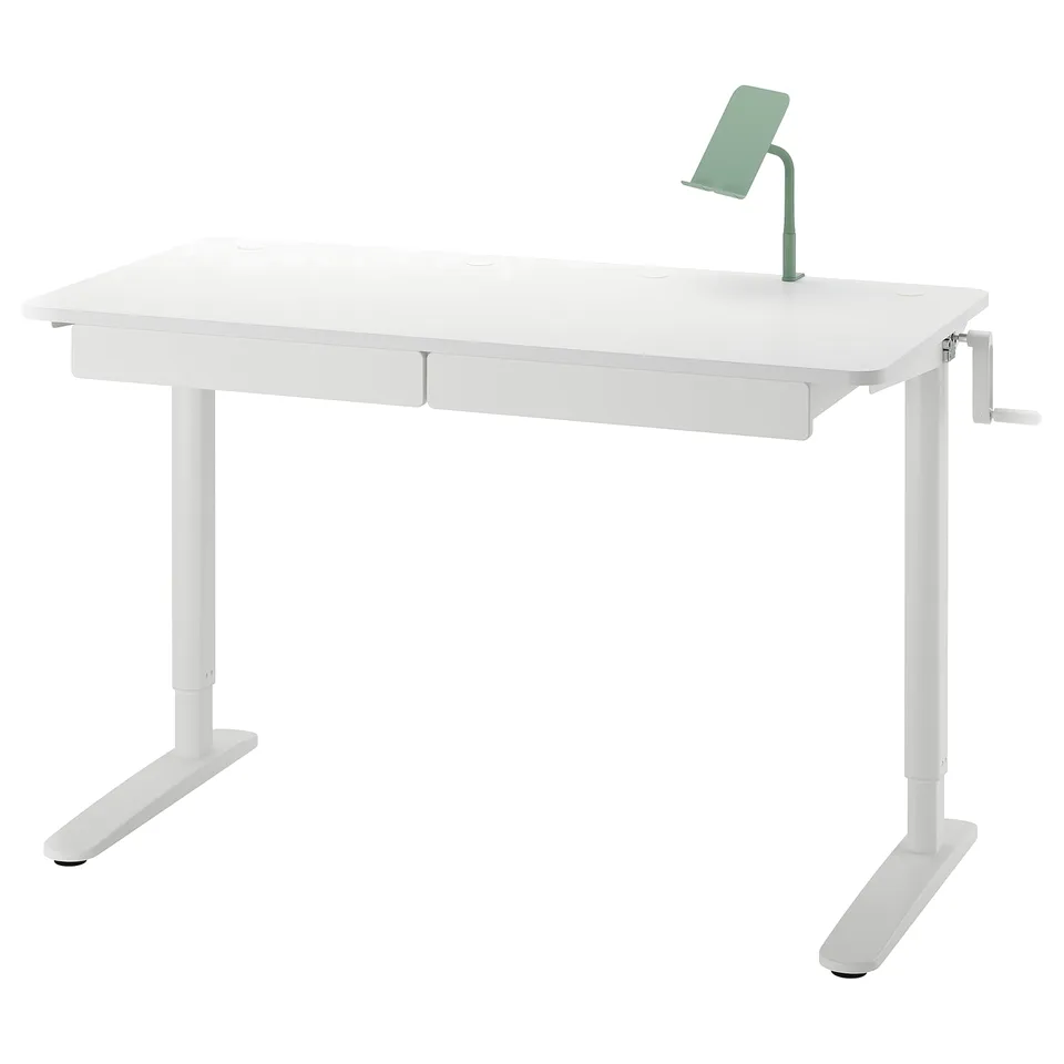 White adjustable desk with green phone holder.