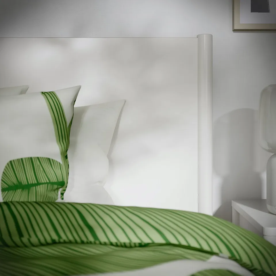 Elegant off-white bed with soft-closing drawers, offering sturdy construction and classic design for long-term use.
