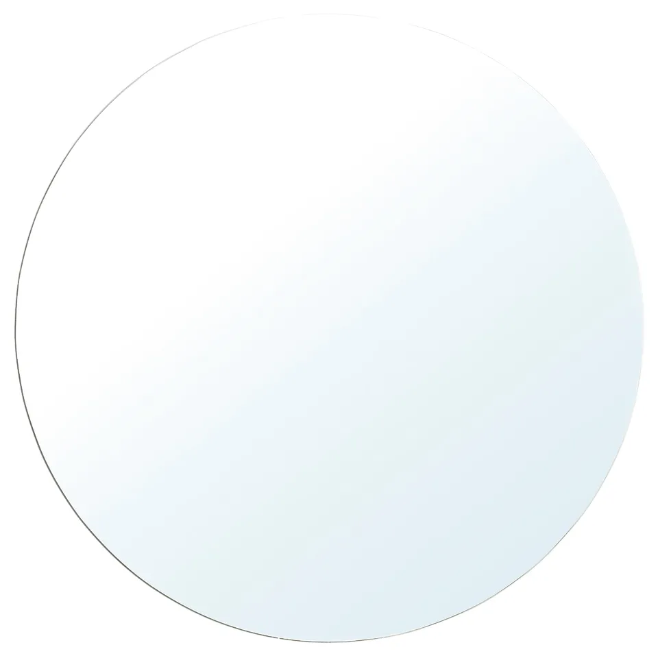 A round BLÅSER mirror in white with a glass and plastic foil frame, reflecting light for enhanced room decor.