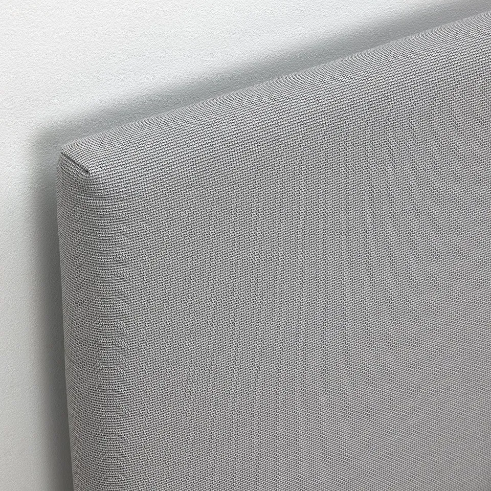 Modern, grey upholstered bed with soft, textured headboard, designed for comfort and style.