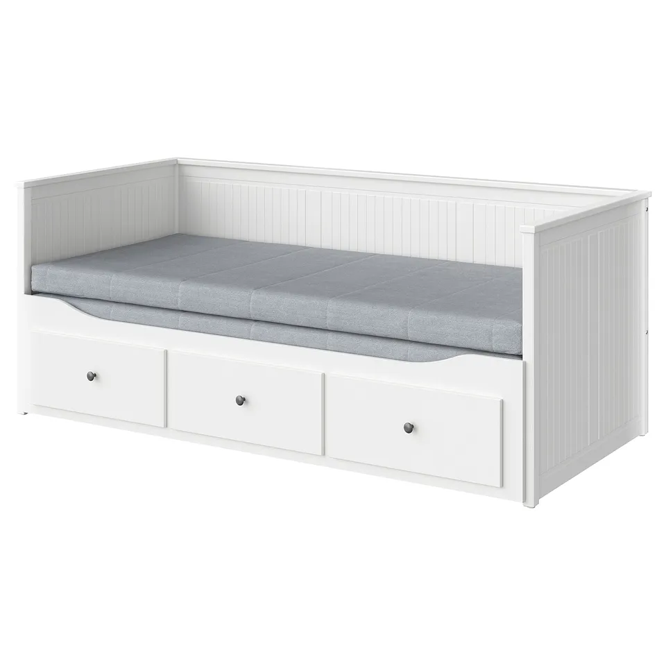 White HEMNES day-bed with drawers and grey mattress.