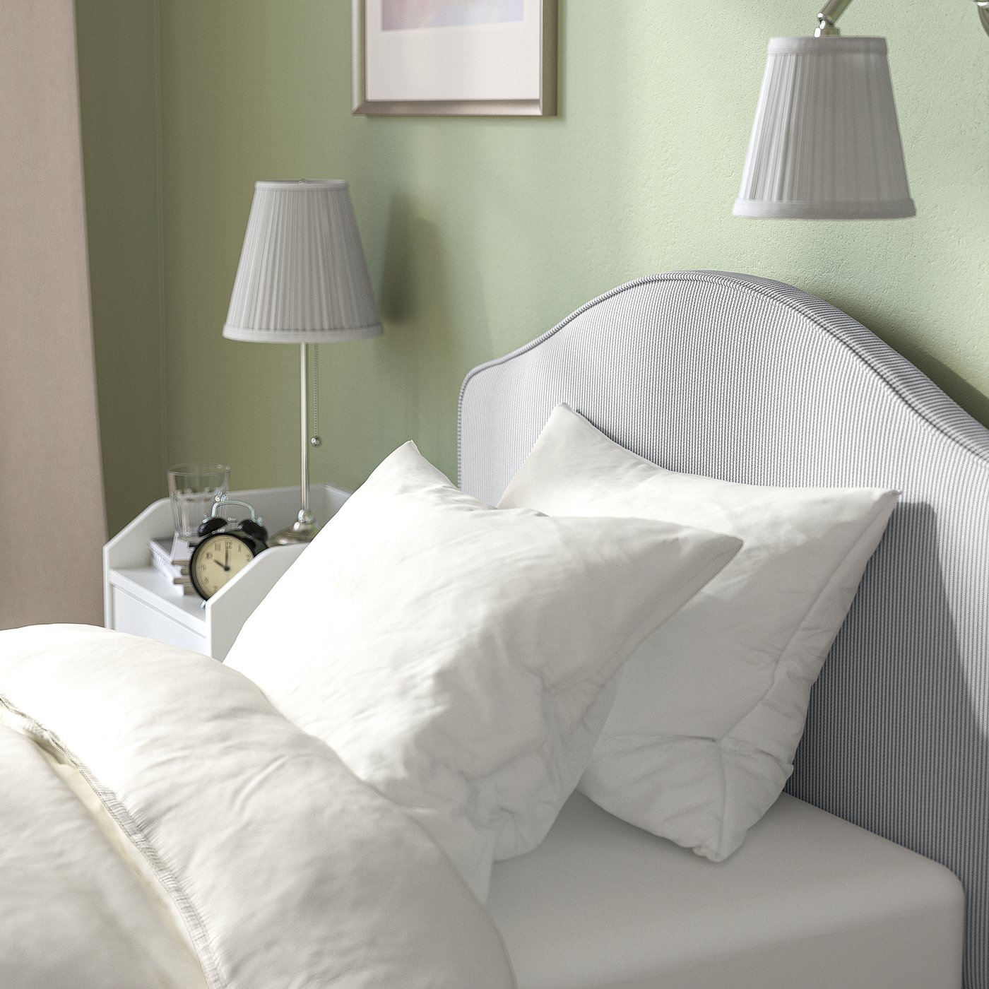 Bedroom scene with RAMNEFJÄLL bed, white linens, and lamps; alarm clock on bedside table.
