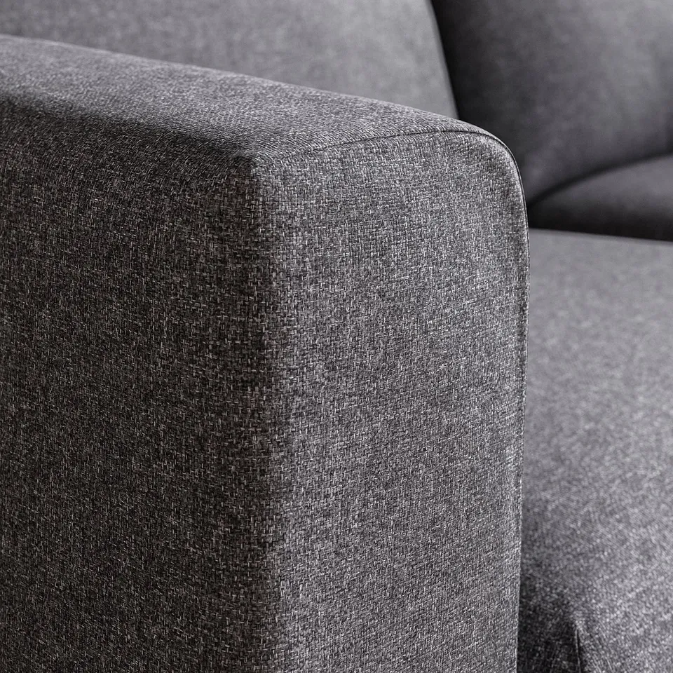 Close-up of a soft, grey fabric sofa, showcasing its smooth, durable texture and comfortable cushions.