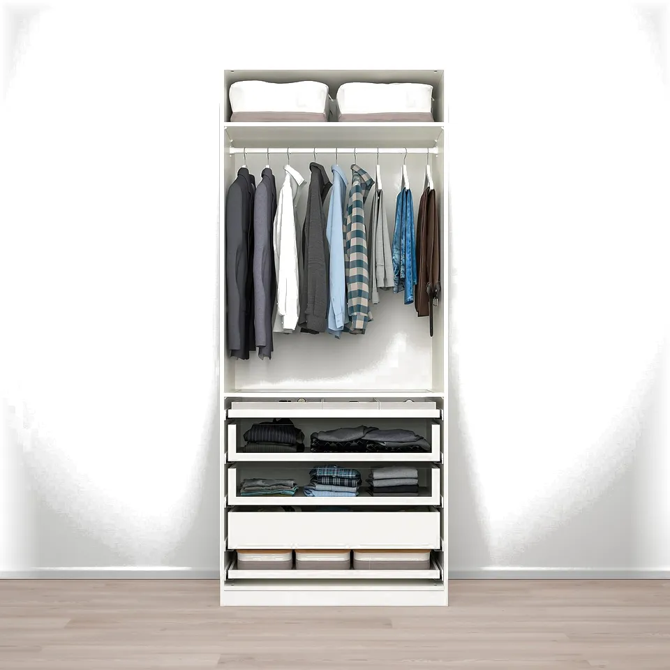 A PAX wardrobe stores clothes neatly, with hangers for shirts and drawers for folded items.
