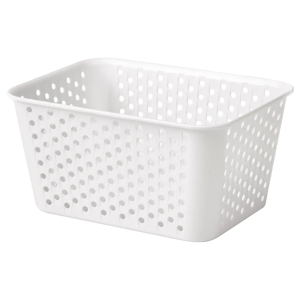 White perforated plastic storage basket, rectangular shape, suitable for organising small items.