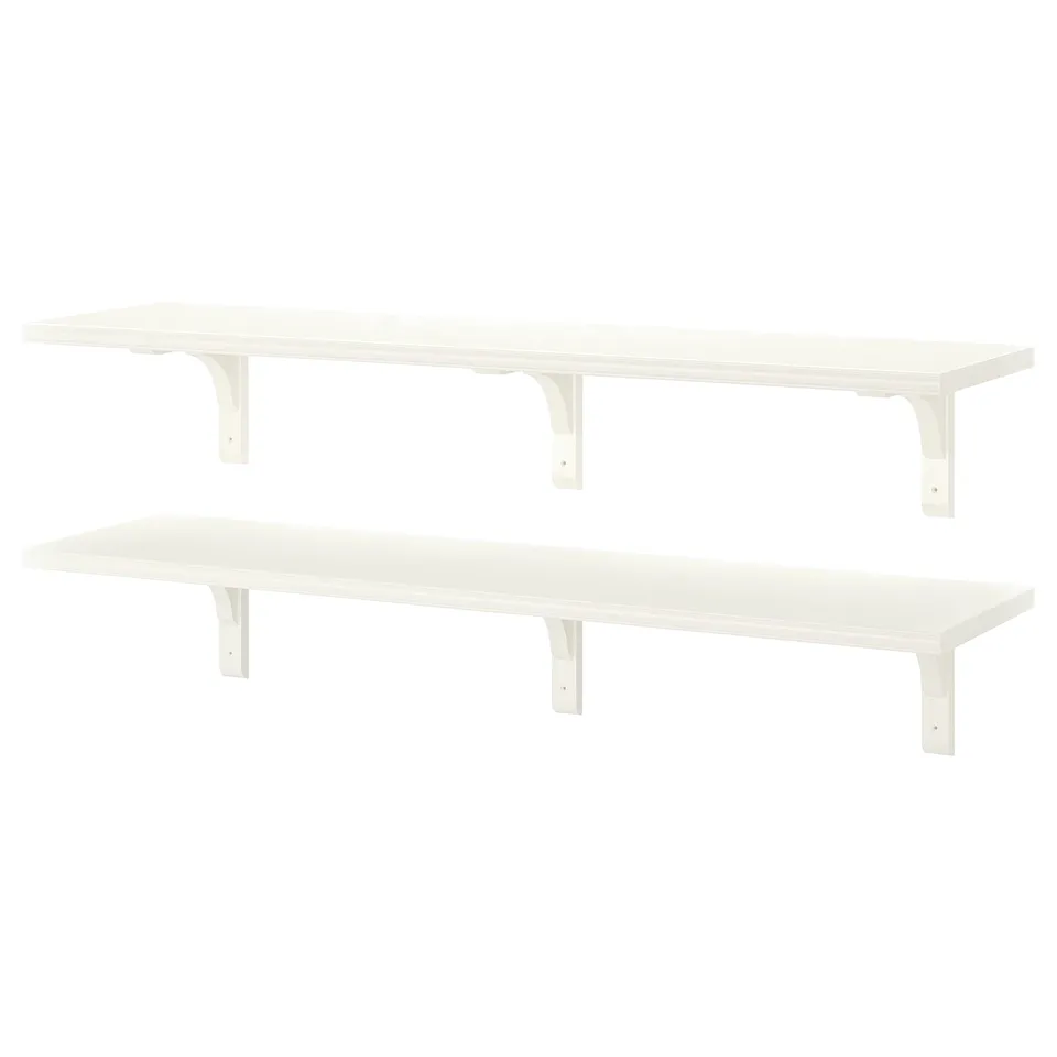 Two white BERGSHULT wall shelves. The shelves have smooth and bevelled edges and are supported by white brackets.
