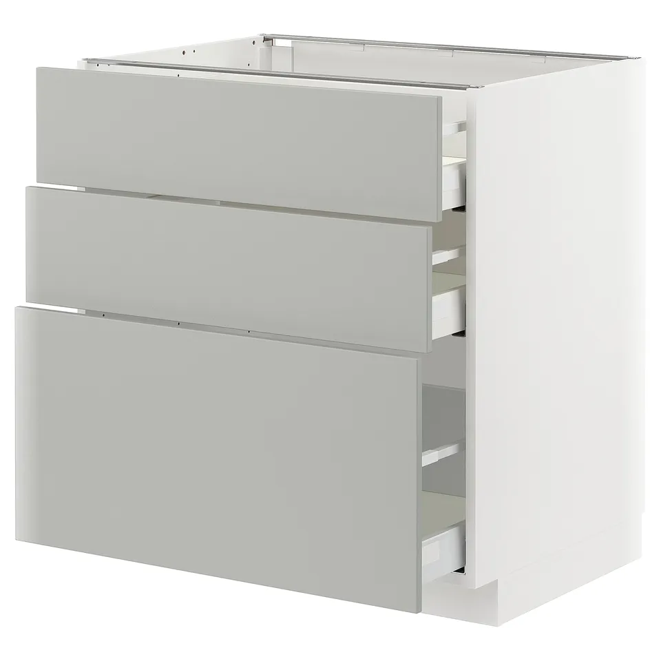 Modern light grey METOD kitchen cabinet with three drawers.