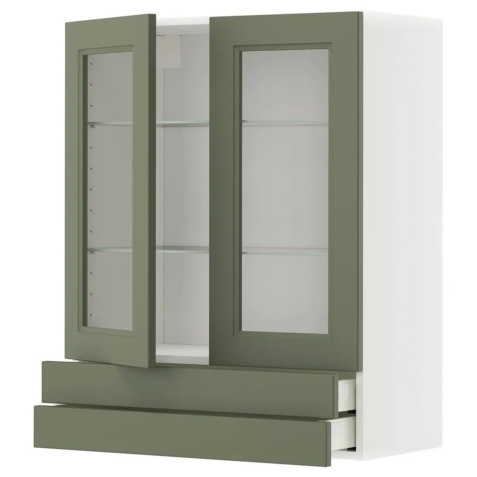 An olive green and white ikea METOD kitchen cabinet with glass doors and a drawer. It a modern design with a sturdy frame and tempered glass shelves.