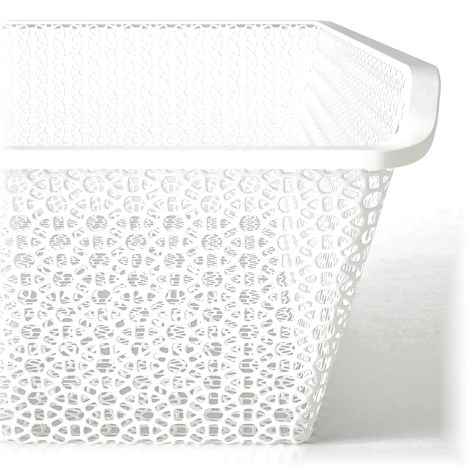 White perforated metal baskets with intricate circular patterns, stacked neatly, showcasing high-quality design and durability.