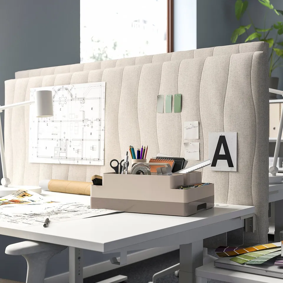 Modern office with KUGGIS organiser near window and blueprints.