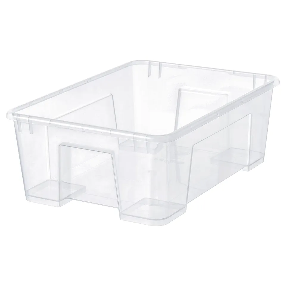 A clear plastic SAMLA storage box. Its transparent, rectangular, with sturdy handles on both sides. Perfect for organising and stacking.