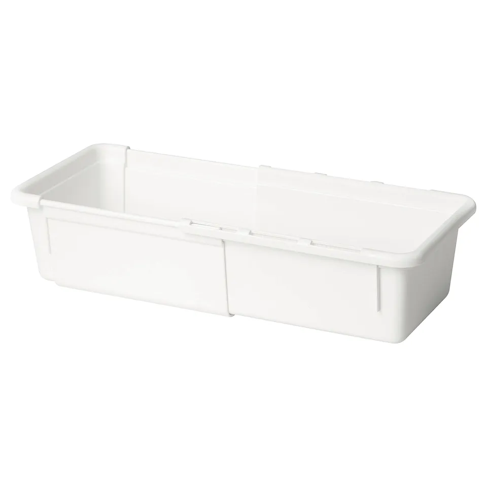 A white KACKLA extendable plastic storage box. It adjusts from 18-28 cm, ideal for organising spaces efficiently.