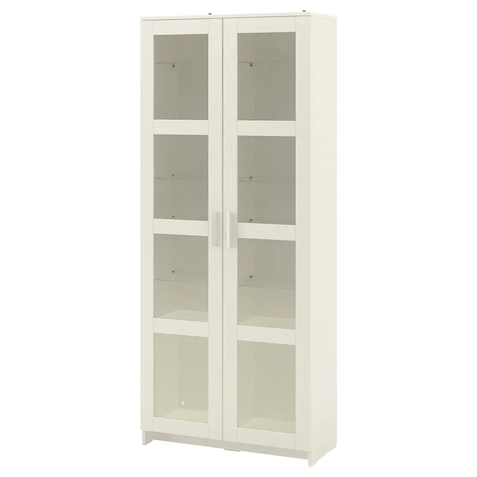An ikea BRIMNES cabinet in white with glass doors. It adjustable shelves for displaying and protecting items.